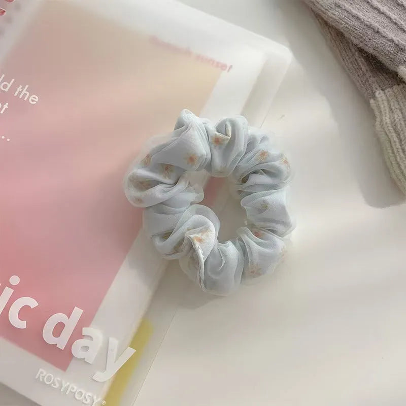 Mesh sense bun cloth hair band for women in milky white, pink, and light blue with large intestine style