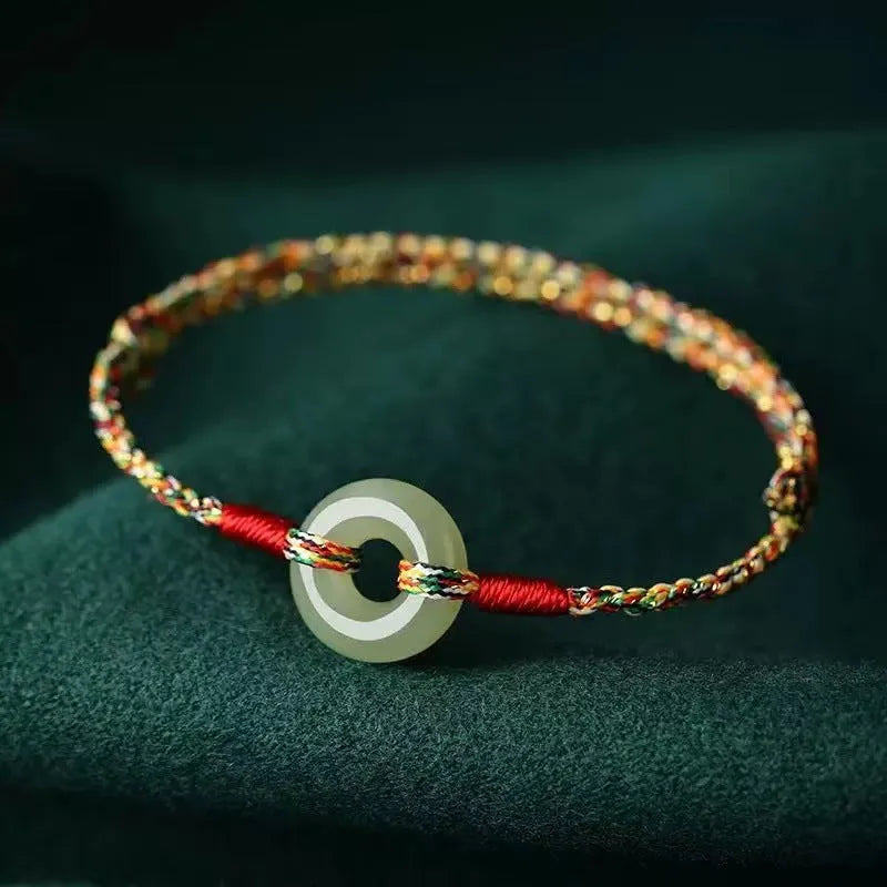Handmade colourful rope bracelet with peace buckle on woven braided design