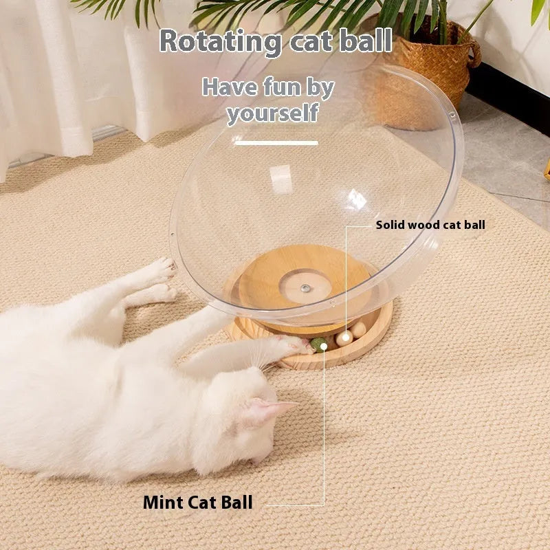 Transparent acrylic space capsule-shaped cat bed on a turntable base.