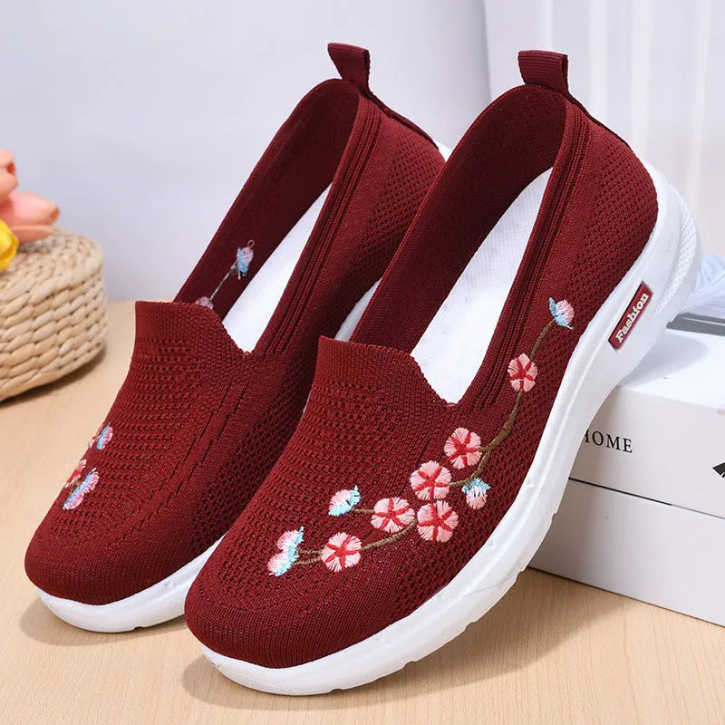 Women's woven floral embroidery casual pumps with a low heel and round toe in wine red colour.