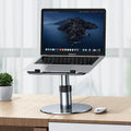 Silver adjustable aluminium laptop stand showing height adjustment and 360-degree rotating base.