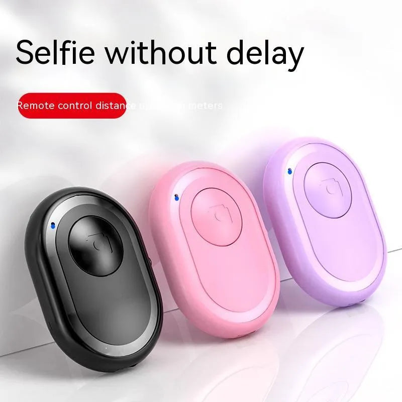 Wireless Bluetooth remote control for smartphone photography in black, pink, and purple colour options