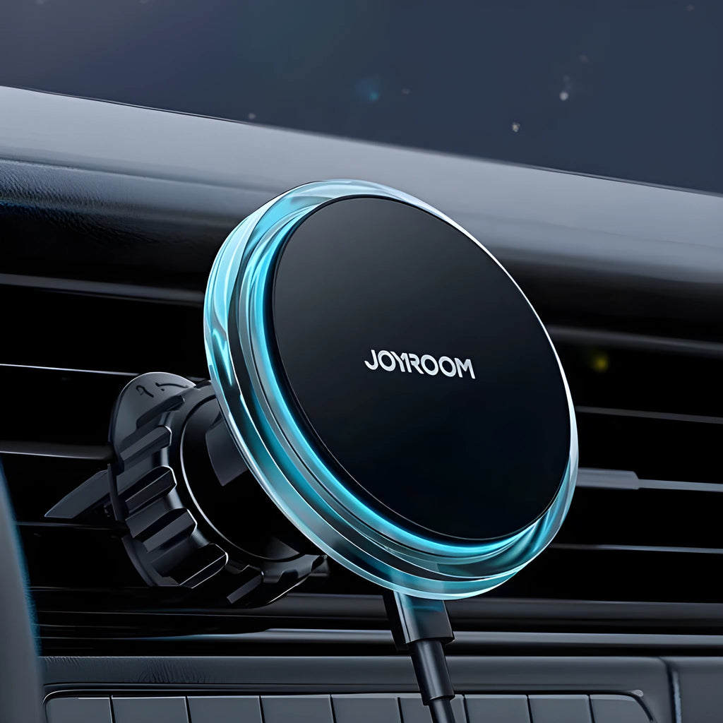 Black magnetic wireless phone charging stand mounted on car air vent