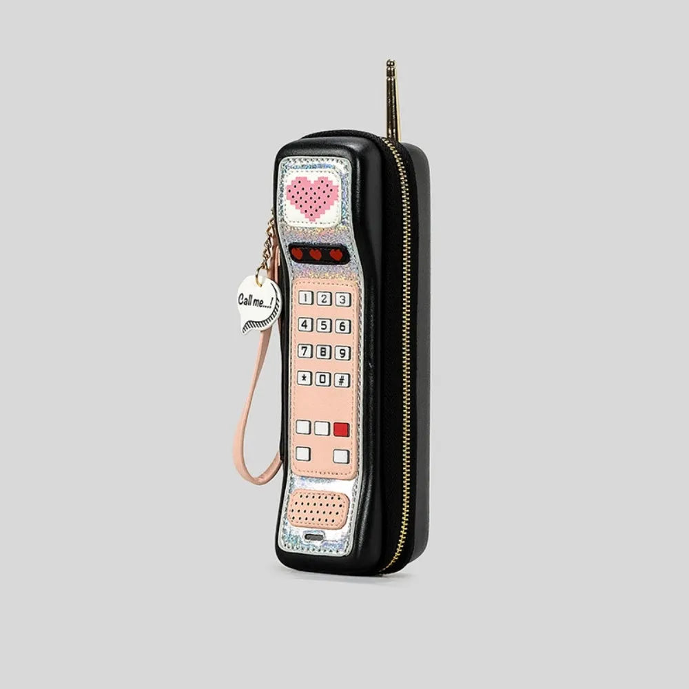 Phone-shaped PU handbag in black with contrast colour panels and slit pocket