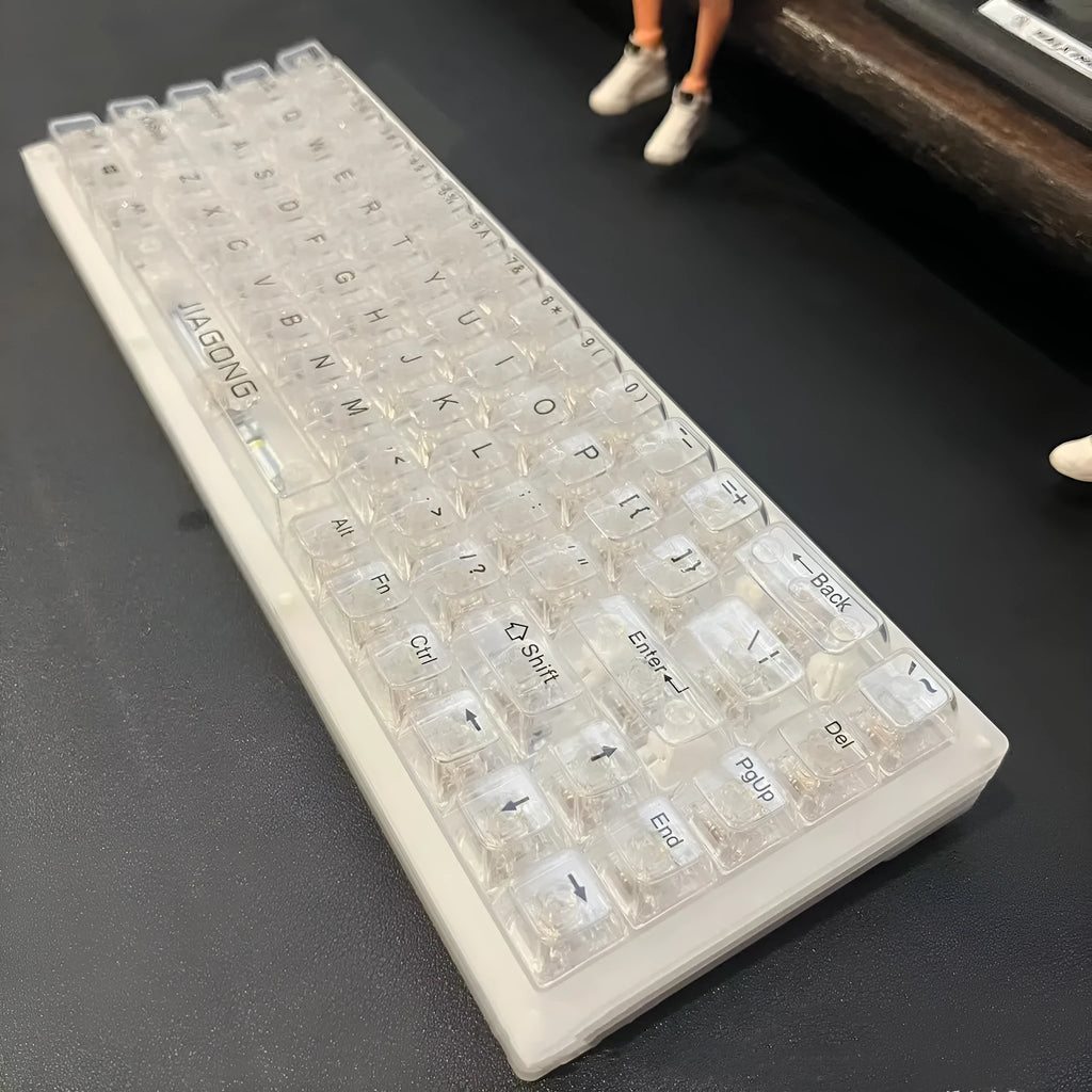 132 transparent plastic key caps arranged for mechanical keyboard replacement