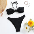 Black women's bikini set with lace-up tube top and split briefs on a plain background.