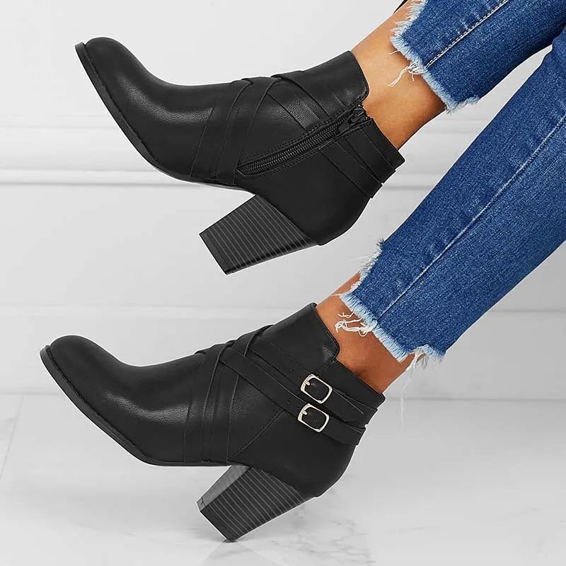 Grey plus size ankle boot with a 7cm chunky heel, side zipper, and buckle detail on a plain toe.