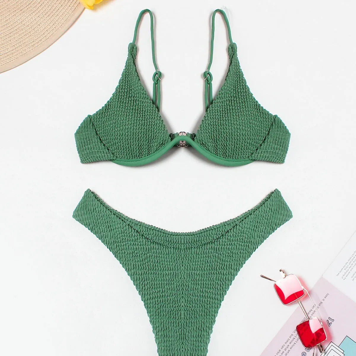 Green women's bikini swimsuit with ruffle detailing and briefs style