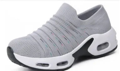 Plus size women's fly-knit socks shoes in light gray with mesh upper and low heel.