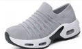 Plus size women's fly-knit socks shoes in light gray with mesh upper and low heel.