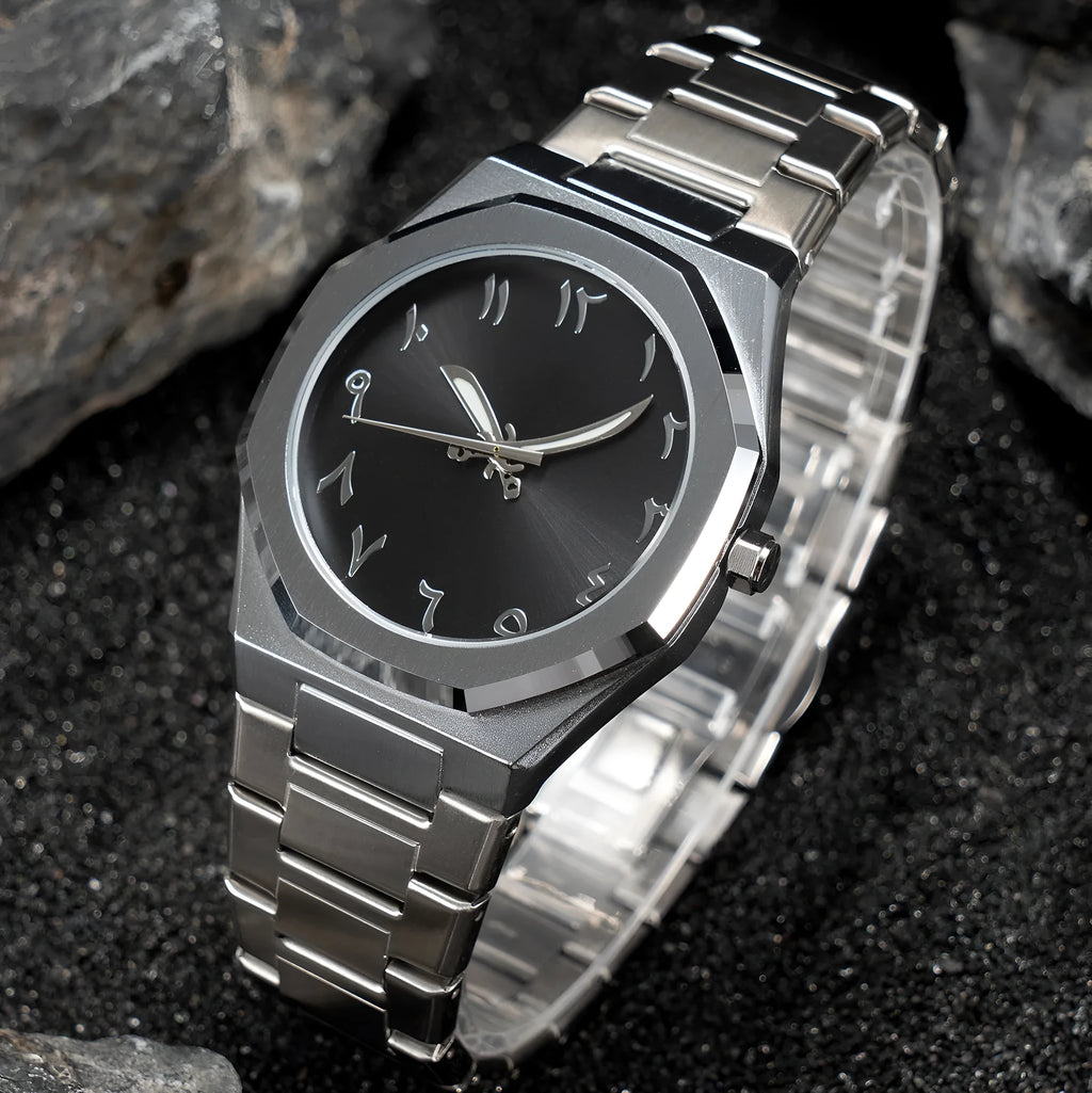 Men's business casual watch with steel bracelet showing black dial and silver scales
