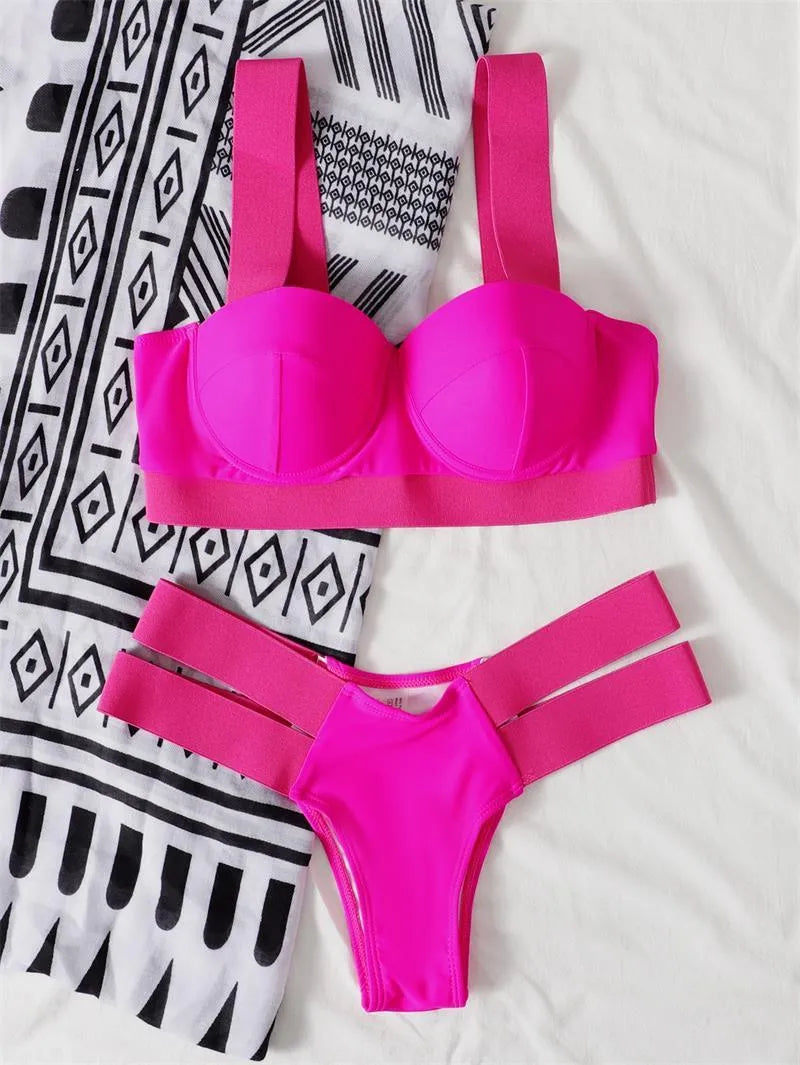 Women's rose red bikini with contrast push-up pads and underwire support on a mannequin.