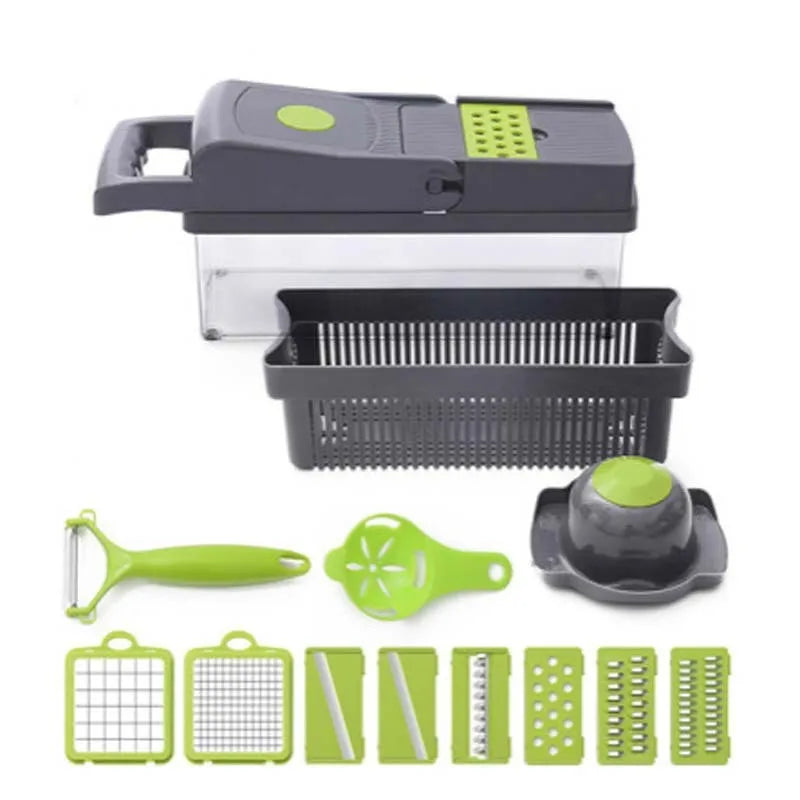 Grey stainless steel vegetable cutter with multiple blades and accessories on kitchen work surface