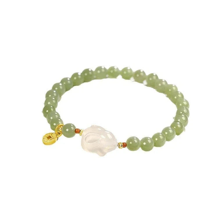 Handmade glass rabbit charm bracelet for women with coloured glaze details
