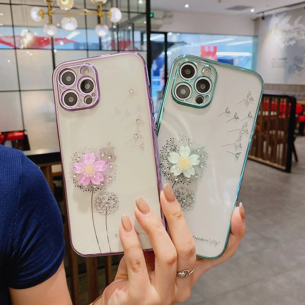 Green iPhone case with 3D white floral design and a silver rotating kickstand extended from the back.