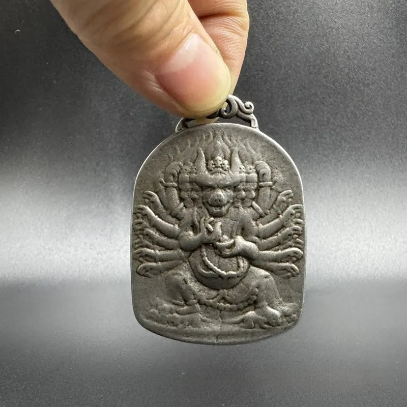Close-up of a Chinese geometric style cast iron pendant ornament with an antique finish.