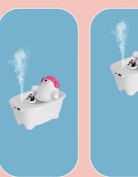 White USB desktop air humidifier with large water tank showing mist output.