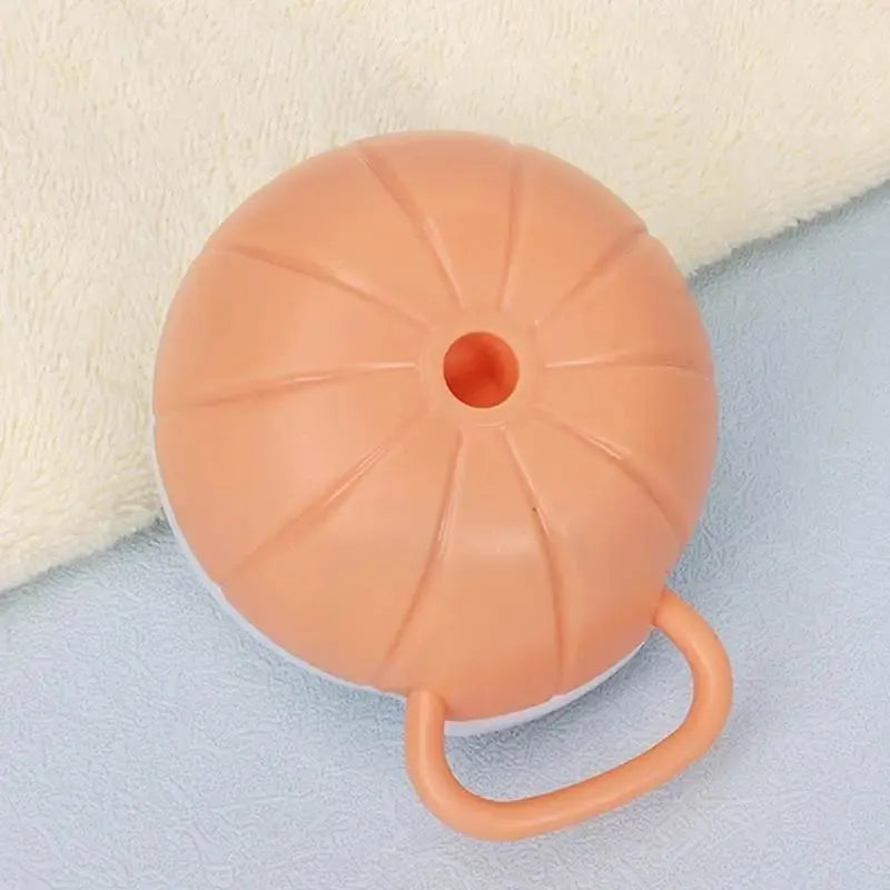Orange TPR dog bath brush with shampoo dispenser and pumpkin-shaped grip