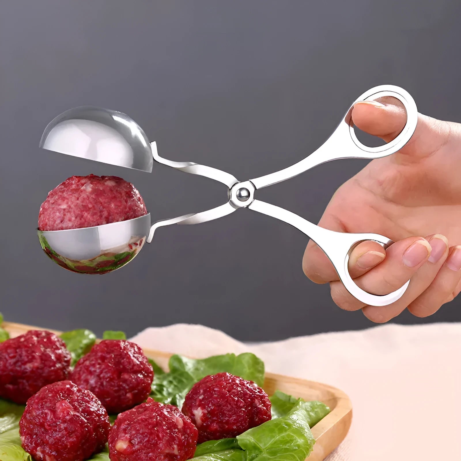 Stainless steel meatball maker tool clip with water-polished finish forming a uniform ball