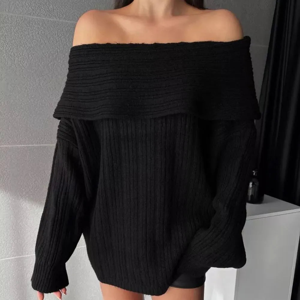 Woman wearing a loose-fitting, long-sleeved, off-neck pullover sweater in a solid colour