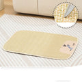 Beige woven cooling mat for cats and dogs on a wooden floor, showing size M