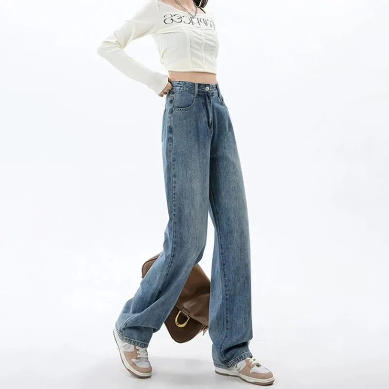 Women's retro blue high-waisted wide-leg denim jeans on a hanger, showing the straight-leg cut.