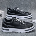 Men's black and white Korean-style low-top platform sneakers with elastic band closure and round toe.