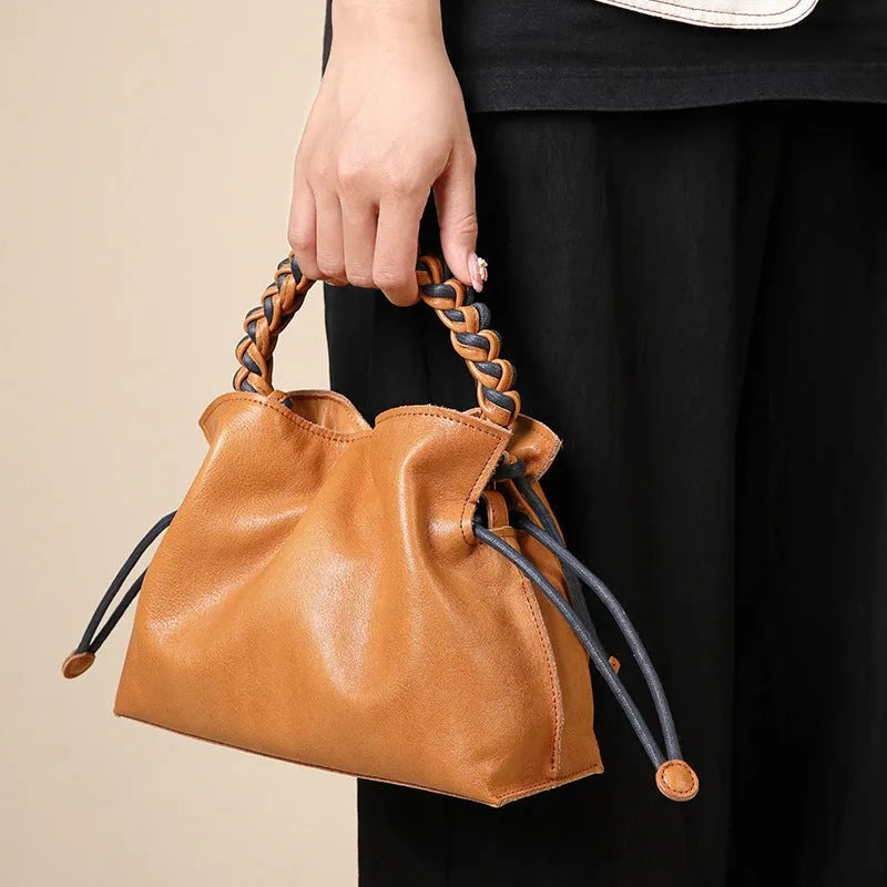 Woven genuine leather women's crossbody bag in light yellow or orange with zipper hidden pocket and polyester cotton lining