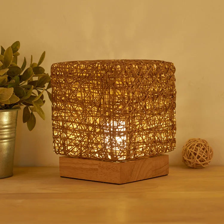 Hand-knit square LED desk lamp with bamboo rattan twine in beige, USB charging, on a wooden desk