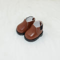 A pair of miniature PU/polyurethane doll shoes for 17cm scale keychain figures.