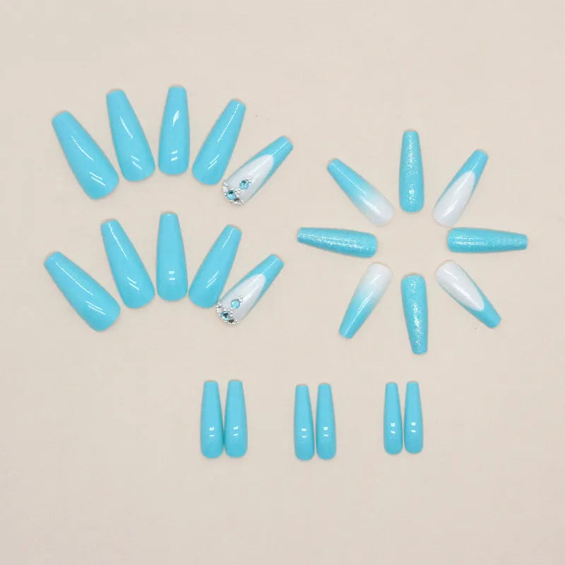 Solid colour long ballet nail art patch with smart blue diamond design on a nail, with glue bottle.