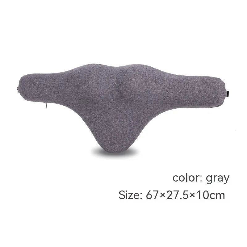 Dark grey memory foam car neck pillow resting on a car seat headrest.