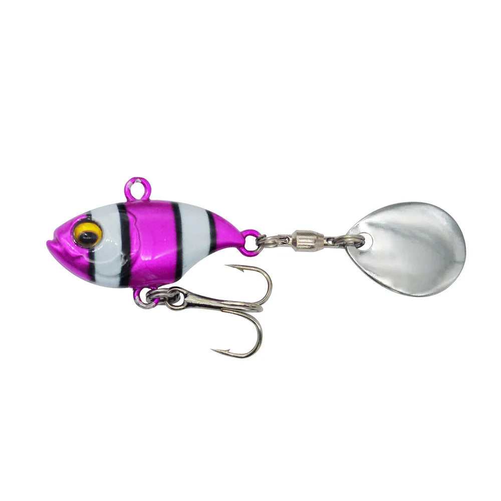 Metal sea fishing lure with a rotating sequin in zebra orange, mesh black, and gold colour variants.