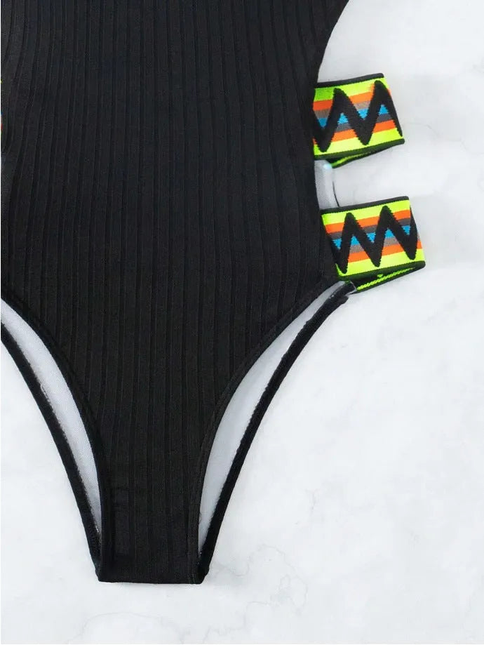Black one-piece scoop-back women's swimsuit made from durable polyester fabric on a mannequin.