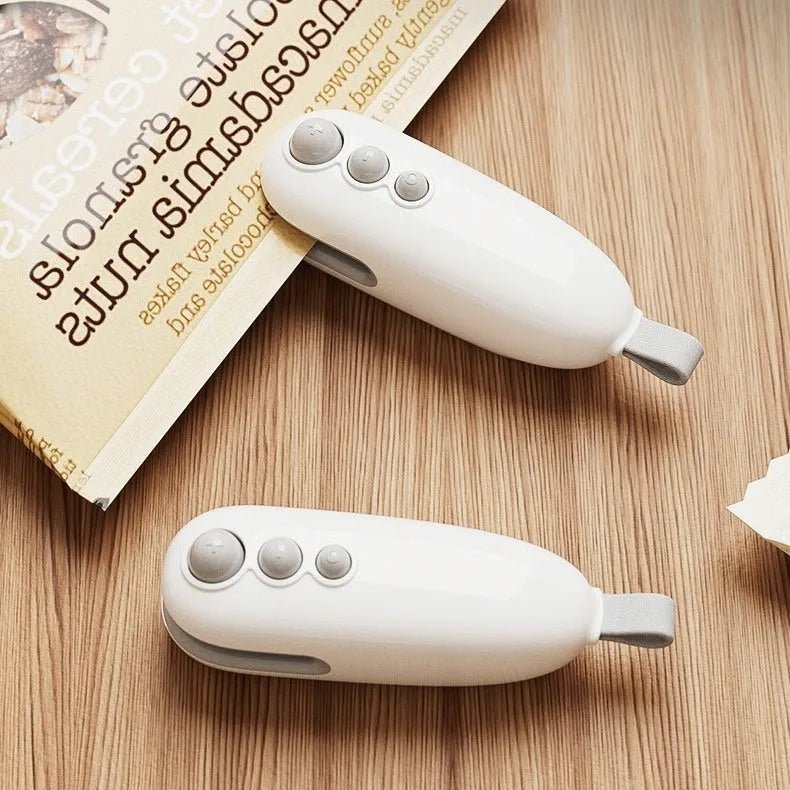 Household mini sealing machine automatic electric thermal capper in ivory white, ABS plastic, USB rechargeable