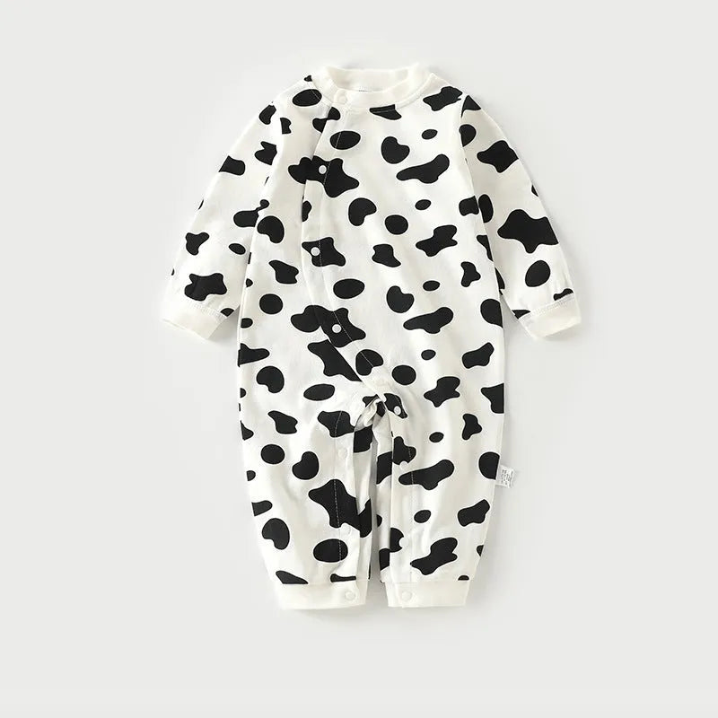 Cotton baby pajamas in cartoon dragon print for a newborn infant.