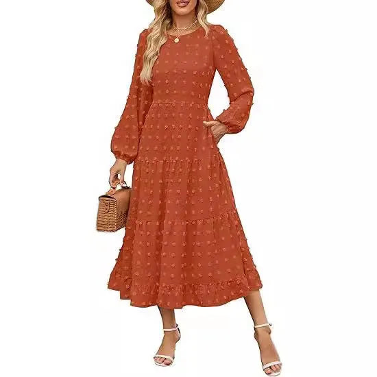 Women's beige long sleeve dress with ruffled sleeves and a high waist, shown on a hanger.