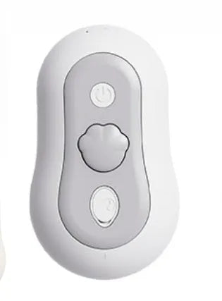 A handheld grey cat grooming massage comb with a brush head and built-in spray nozzle.