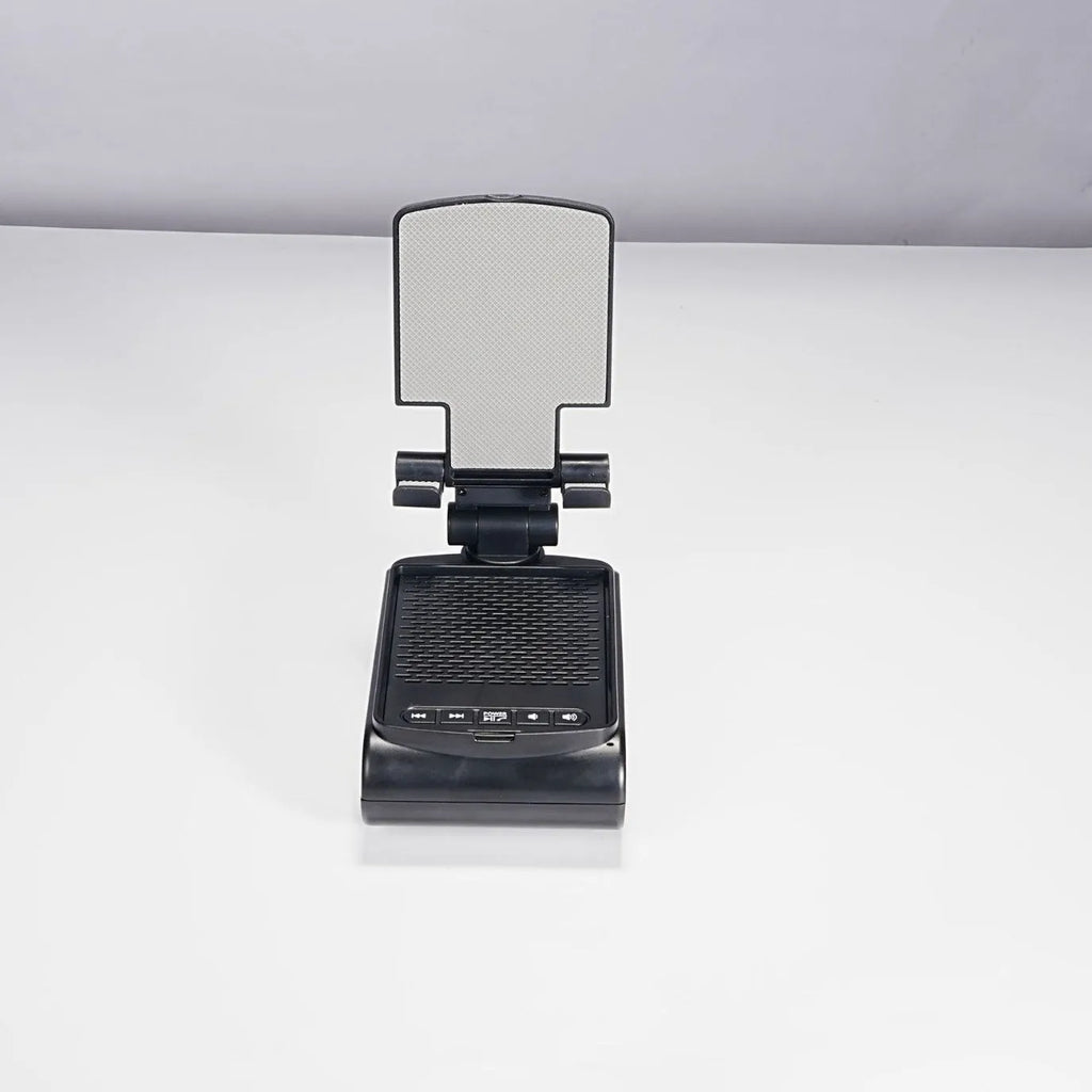 Multi-function plastic lazy phone holder with built-in Bluetooth speaker, USB powered, black colour, showing phone in stand
