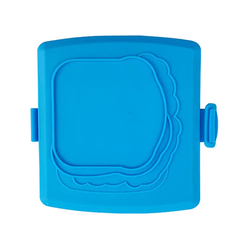Red silicone baking tray and matching heat-resistant gloves set on kitchen counter