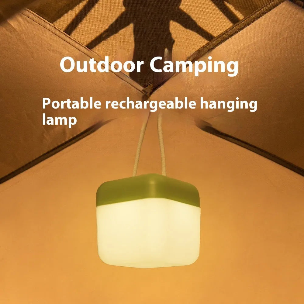 LED hanger solid color portable rechargeable light in green with remote control on a table