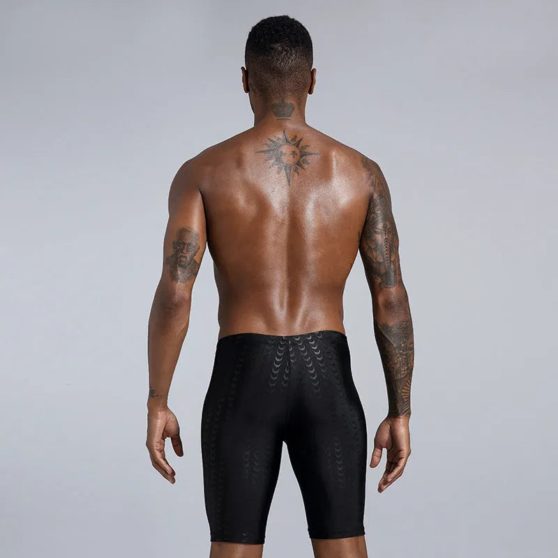 Men's solid colour swimming trunks in waterproof polyester fabric available in larger sizes