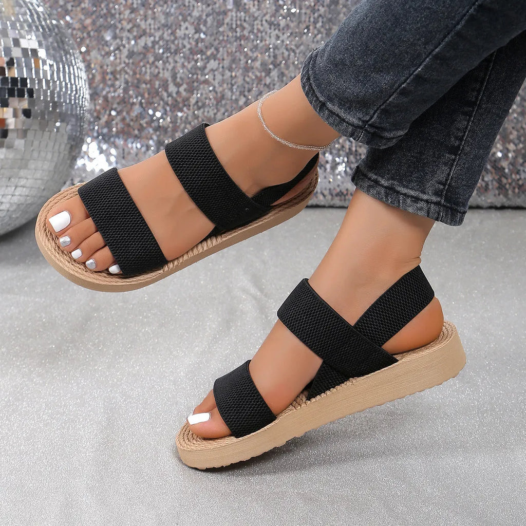 Women's flat wedge beach sandals with elastic band upper and round toe in median brown hemp colour