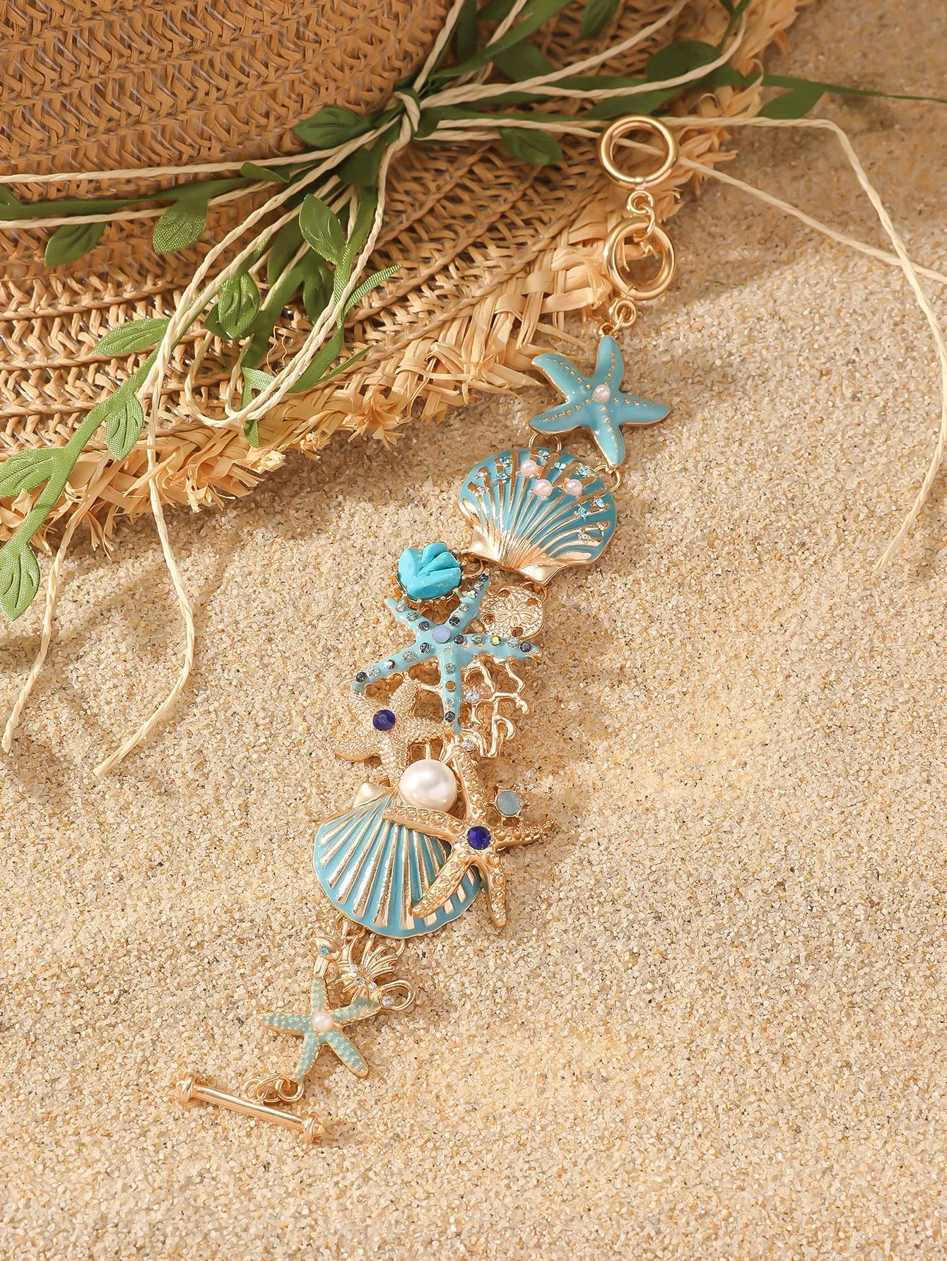 Women's alloy bracelet with starfish, star, and anchor design in turquoise, red, or blue colour.