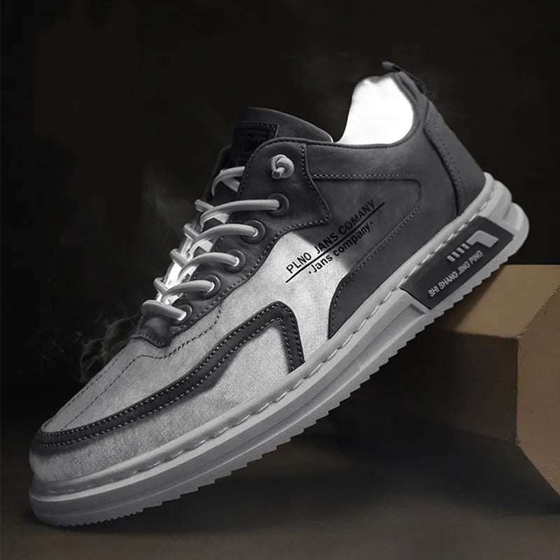 Men's green canvas lace-up sneakers with round toe, flat heel, and letter print side detail on a white background