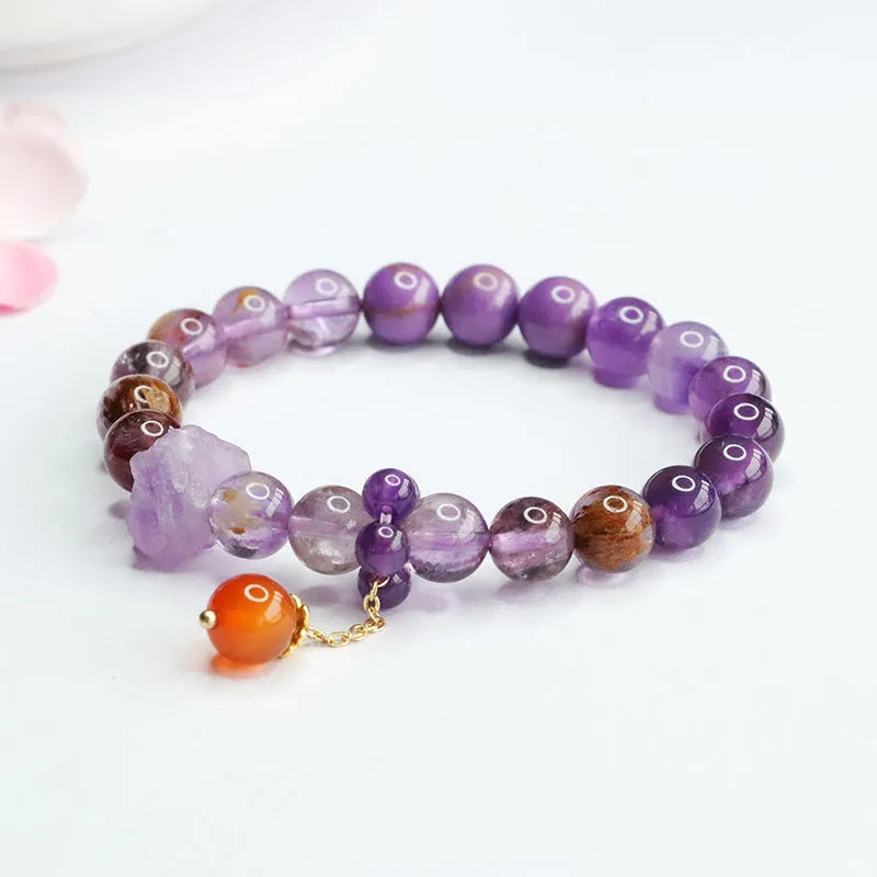 Nine purple fire amethyst bracelet with red agate accents in Mori style design