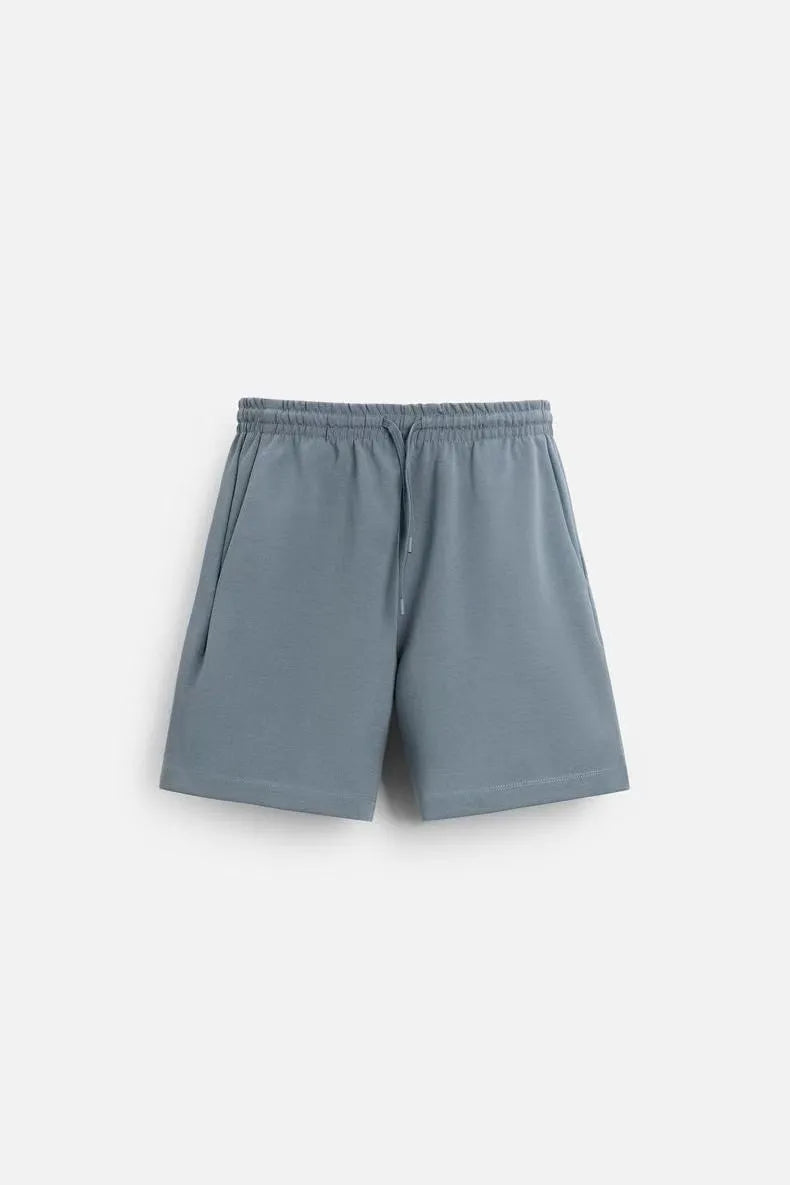 Loose double-sided texture polyester short sleeve top and matching shorts set on a hanger