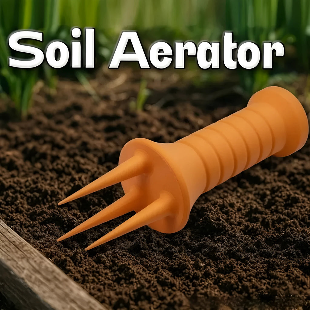 Home gardening soil aerator plastic hand tool in orange, 3.3cm x 10cm size, on soil