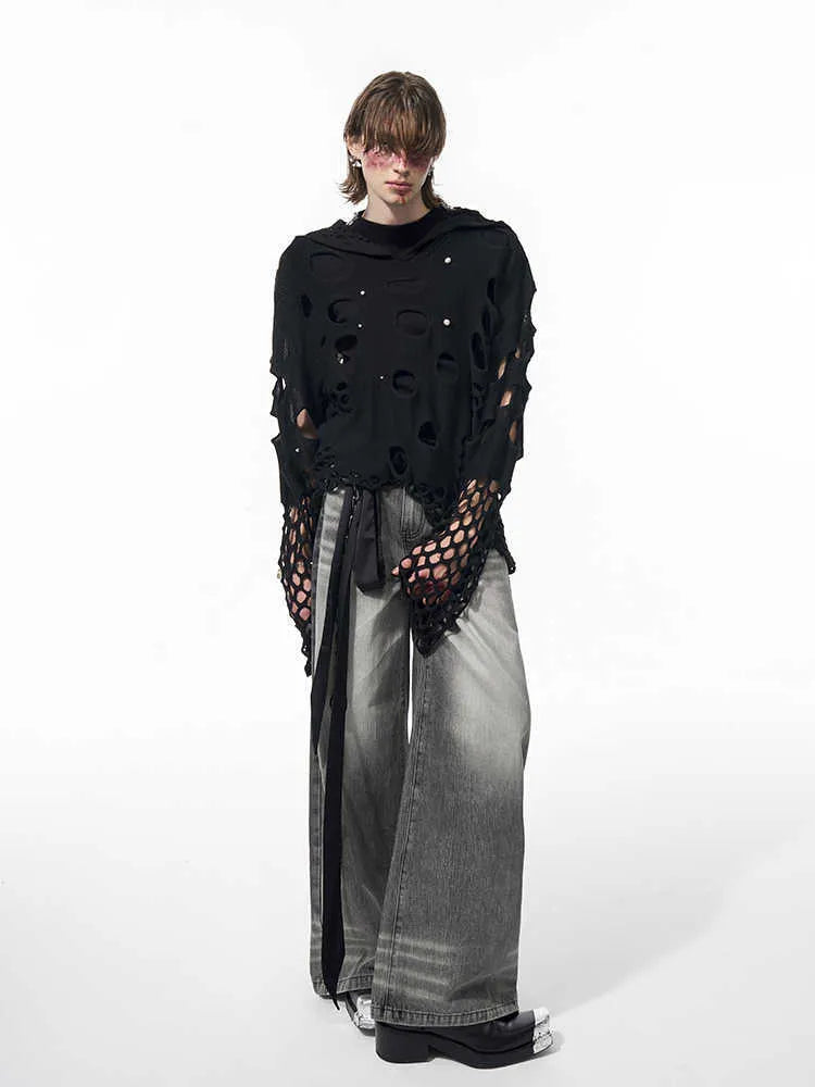 Black loose-fit men's pullover hoodie with a hood and pearl decorative detail on the front.