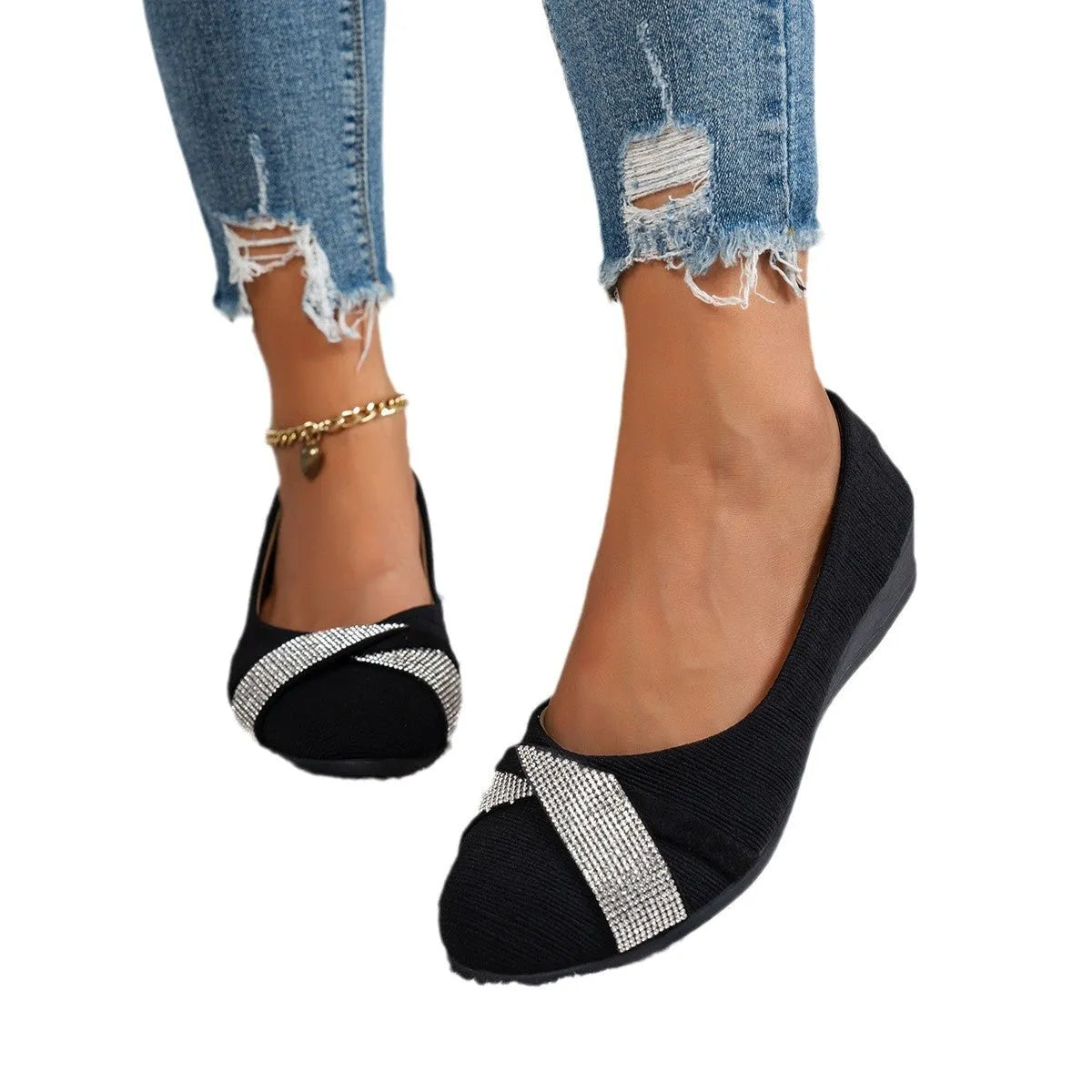 Women's black slip-on casual shoes with rhinestone decoration and a chunky heel.